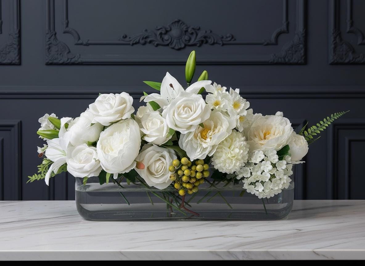 White Floral Centerpiece in Long Glass Vase