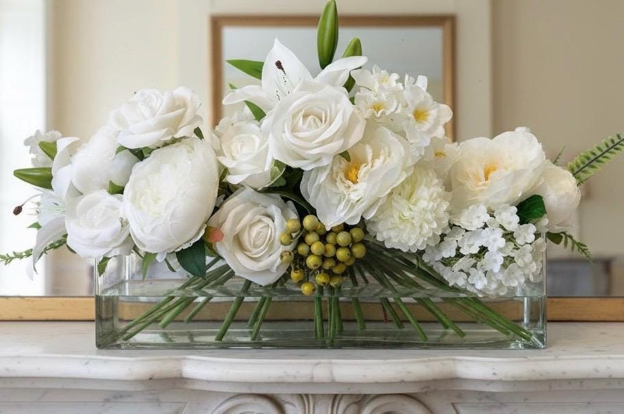White Floral Centerpiece in Long Glass Vase