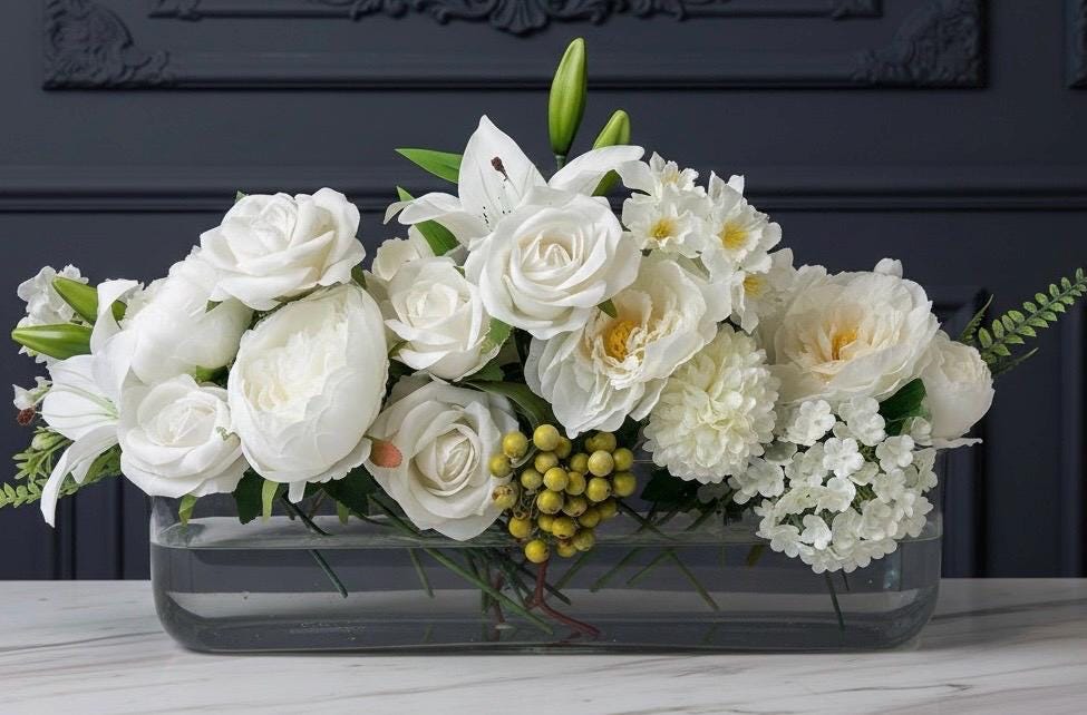 White Floral Centerpiece in Long Glass Vase