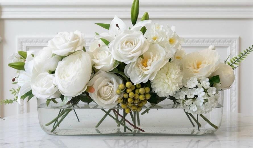 White Floral Centerpiece in Long Glass Vase