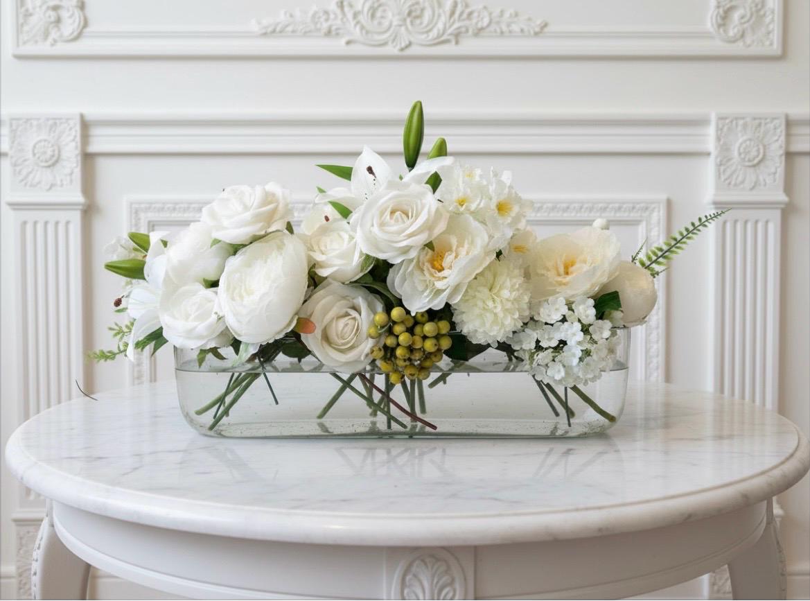 White Floral Centerpiece in Long Glass Vase