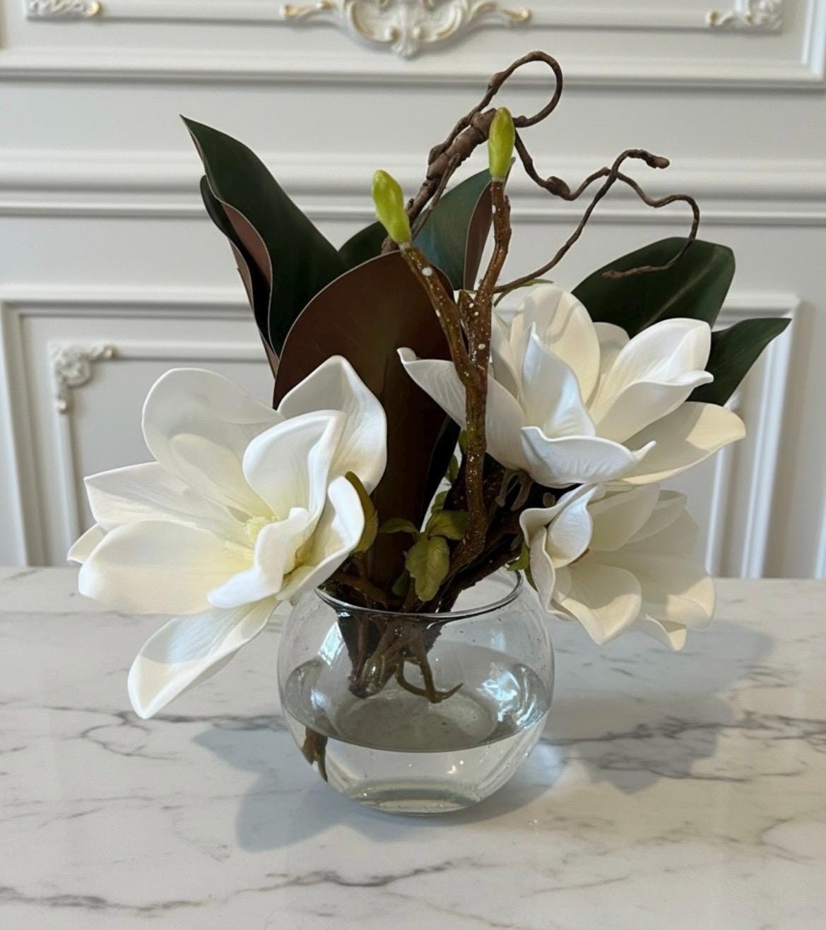 Faux Magnolia Blossoms in Glass Ball Vase with Water Illusion