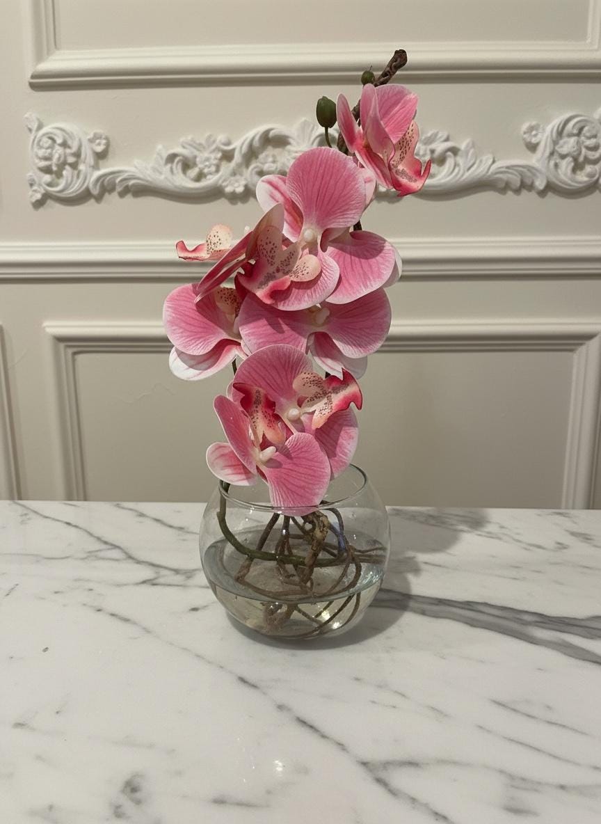 Real touch pink orchid in glass vase with roots and water illusion