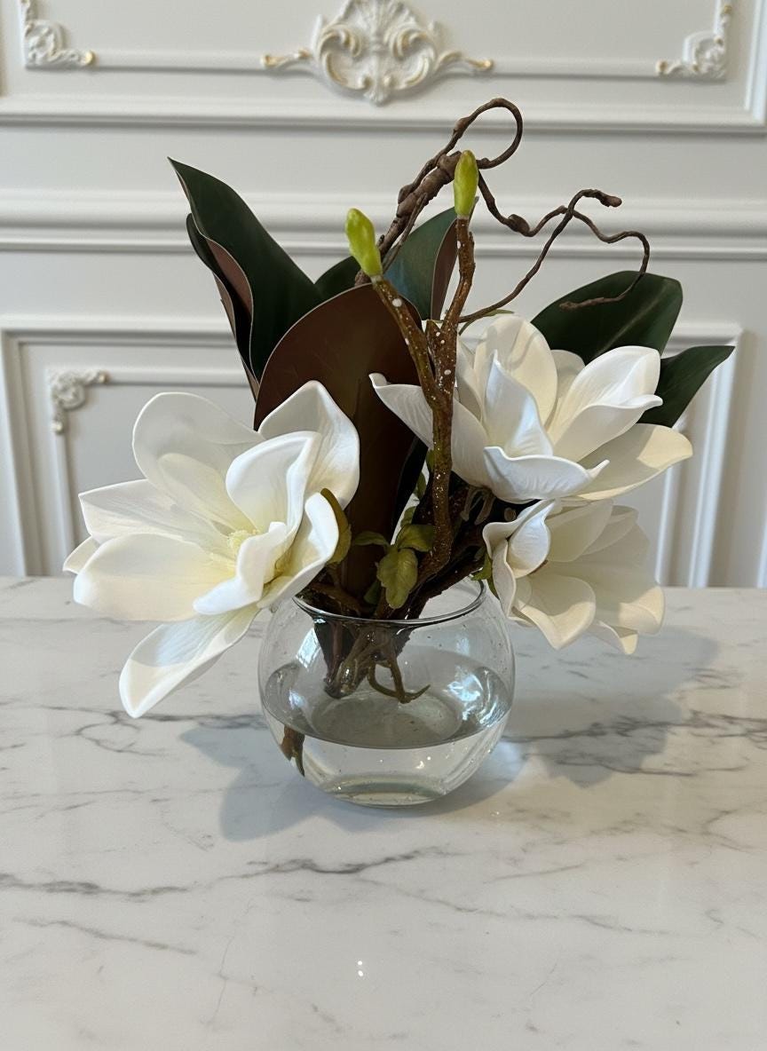 Faux Magnolia Blossoms in Glass Ball Vase with Water Illusion